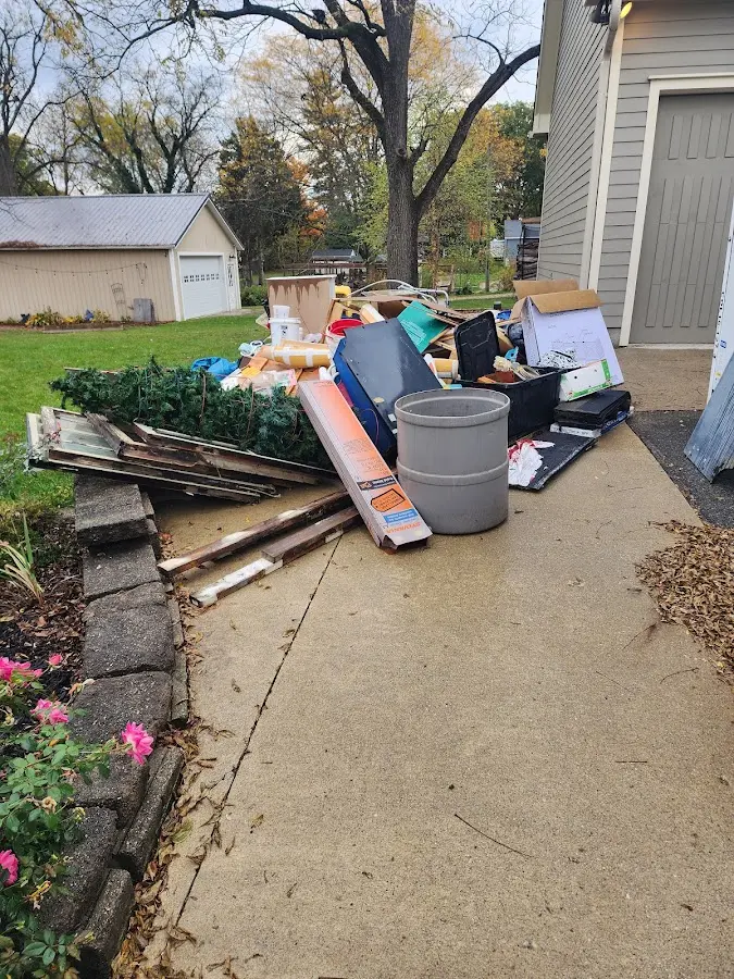 Dumpster being loaded with debris for 3 Yard Dumpster Rental in Lake Clarke Shores
